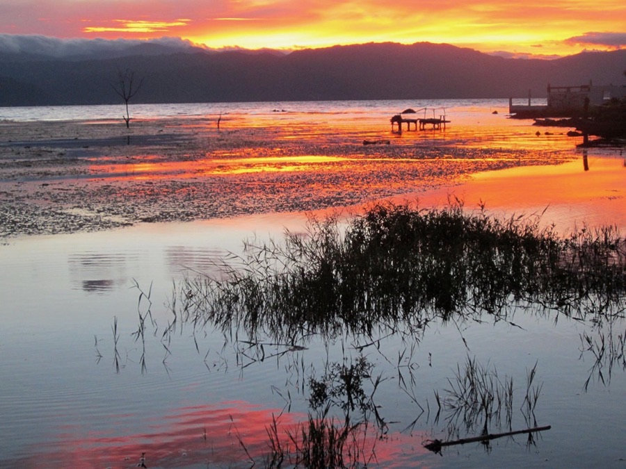 Orange sunrise over Lake Atitlán